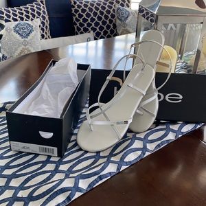 Bebe white sandals size 8 with adjustable buckle.